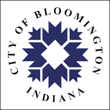 Logo of the City of Bloomington, Indiana, with a blue geometric star motif inside a circular border reading 'City of Bloomington Indiana'