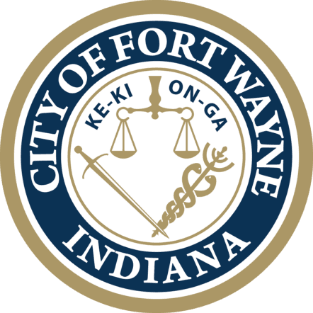 Official seal of the City of Fort Wayne, Indiana, featuring scales of justice, a sword, and a caduceus within a blue ring.